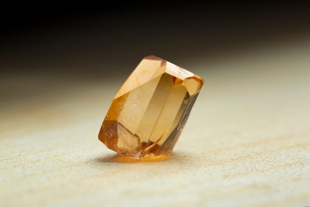Topaz yellow natural quartz blue gem geological crystals texture backgroun